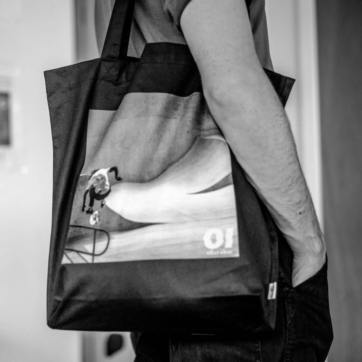 other ideas eco streetwear black organic cotton canvas streetstyle tote bag with black and white skateboarding "Jump" photo modelled side view