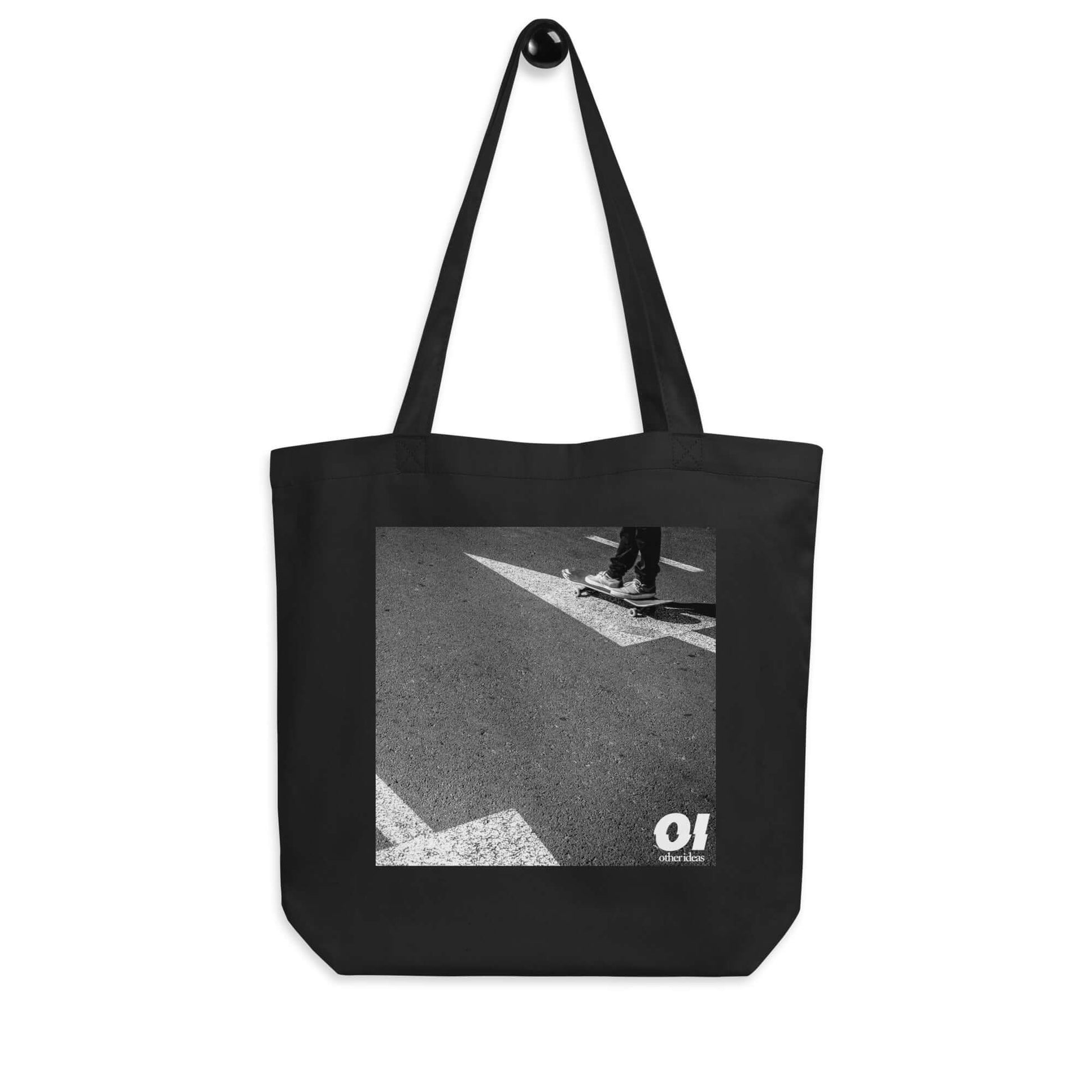 other ideas eco streetwear natural oyster organic cotton canvas streetstyle tote bag with black and white skateboarding "Arrows" printed on hanger view