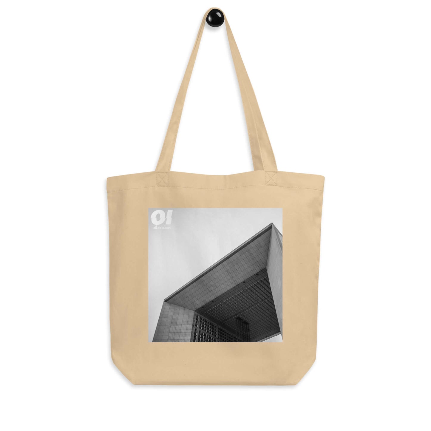 other ideas eco streetwear natural oyster organic cotton canvas streetstyle tote bag with black and white Paris La Defense printed on hanger view