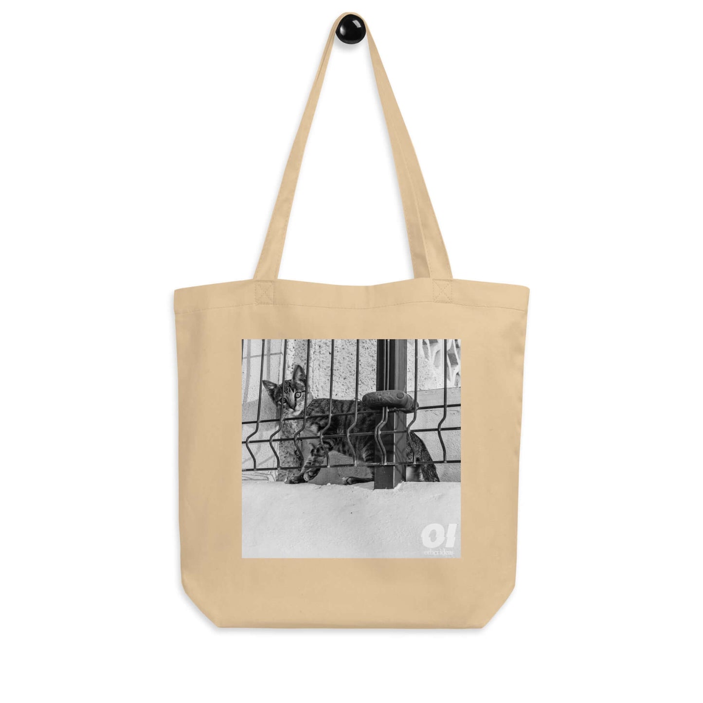 other ideas eco streetwear natural oyster organic cotton canvas streetstyle tote bag with black and white nosy cat printed on hanger view