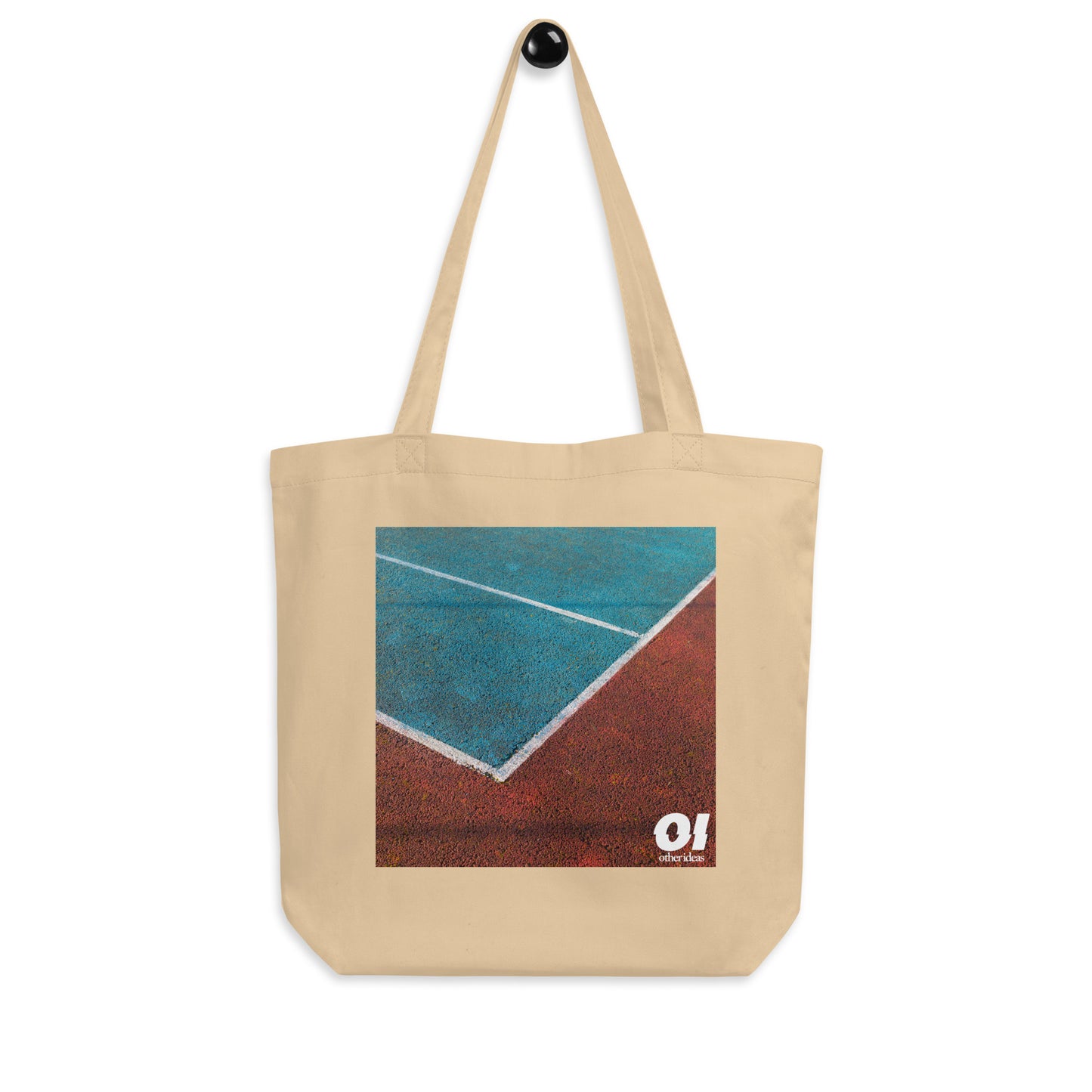 other ideas eco streetwear natural oyster  organic cotton canvas streetstyle tote bag with high contrast colour tennis court photo printed on hanger view