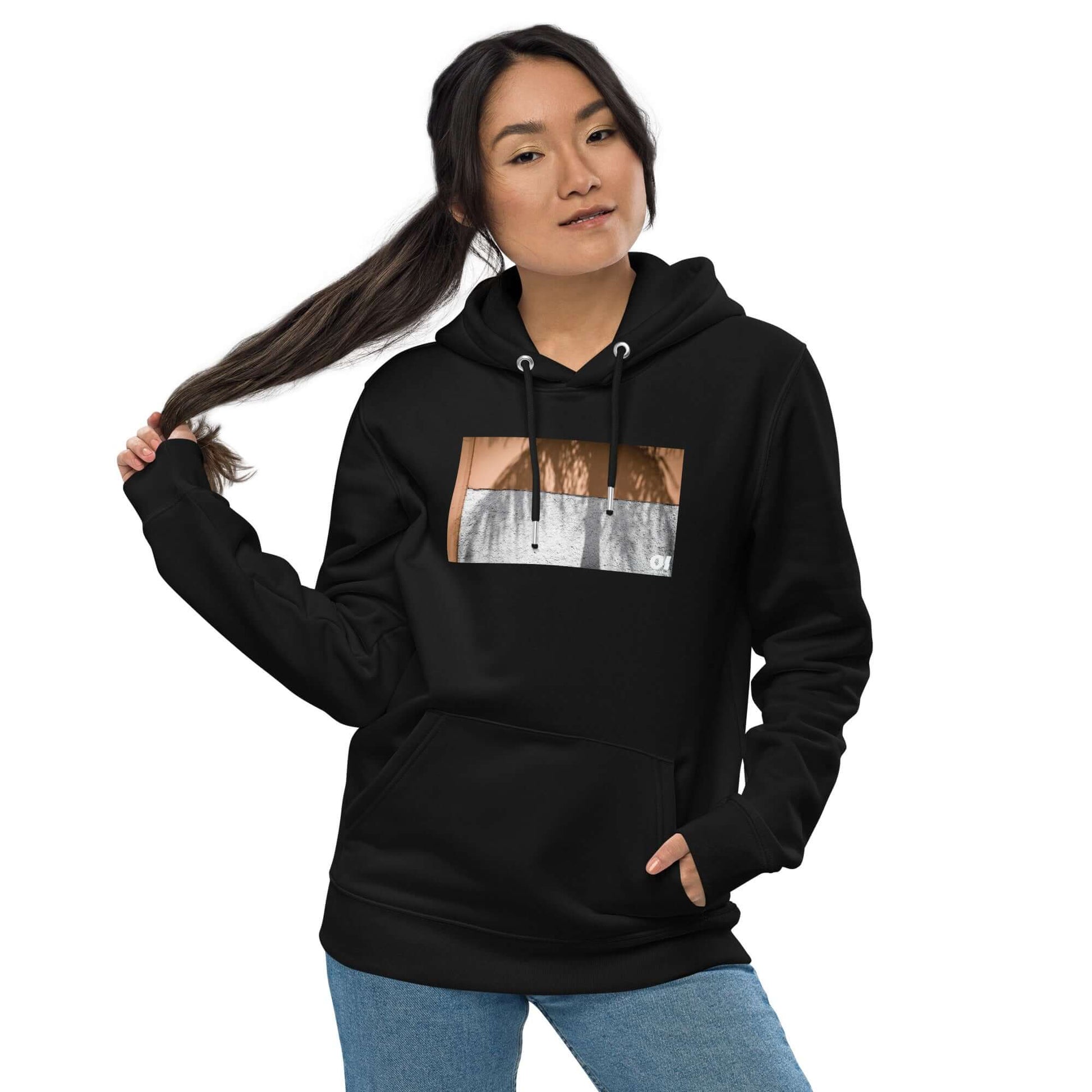 other ideas eco streetwear women's classic black sweatshirt hoodie with colour palm tree shadow photo print organic cotton blend jersey sustainable slow fashion modelled from the front view with hood down